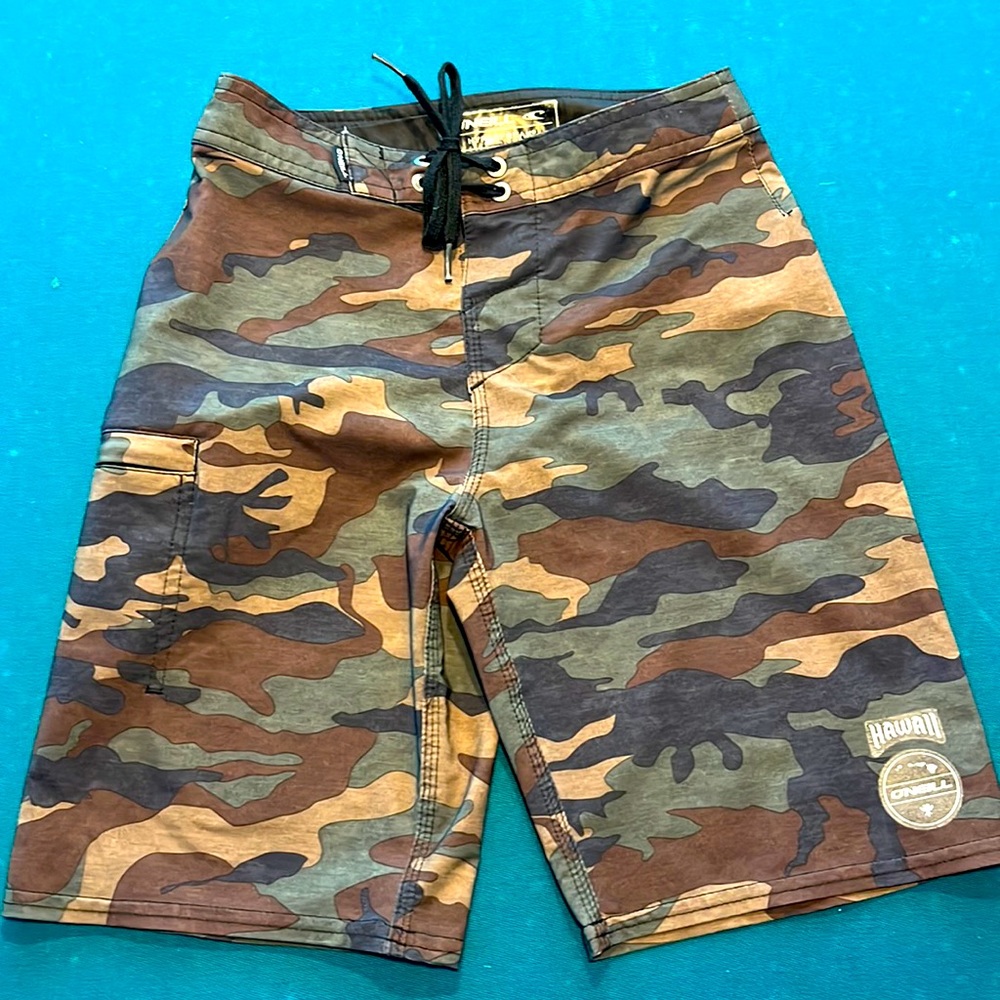 Boys , size 23, O’niel board shorts.